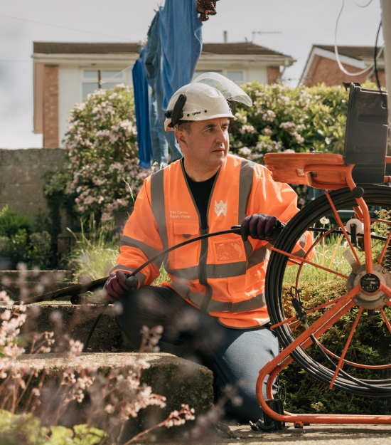 Welsh water employee working at a residence