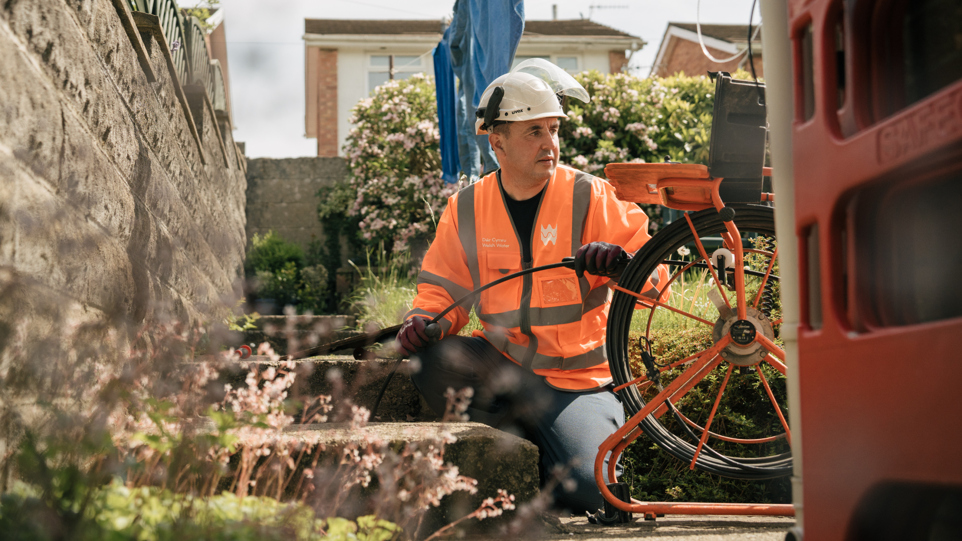 Welsh water employee working at a residence